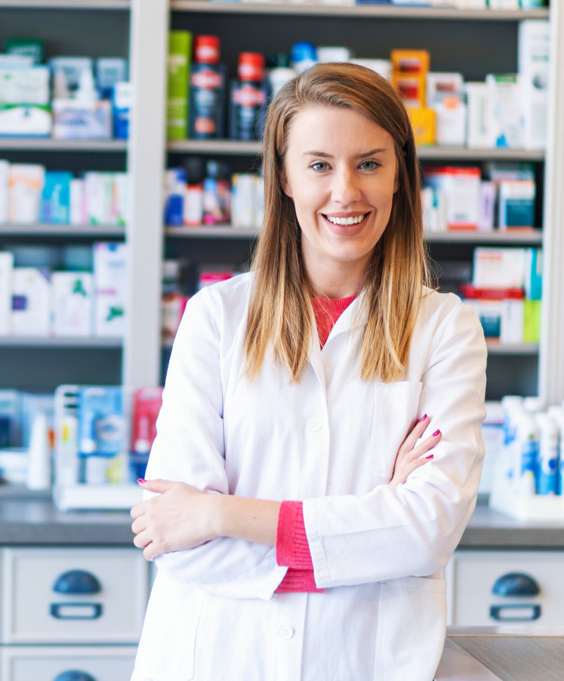 smiling woman inside a pharmacy